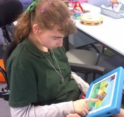 Student playing a colourful game on a mobile device